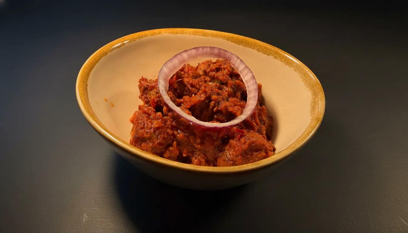 Lamb bhutuwa stir-fry with peppers, onions, and fenugreek.