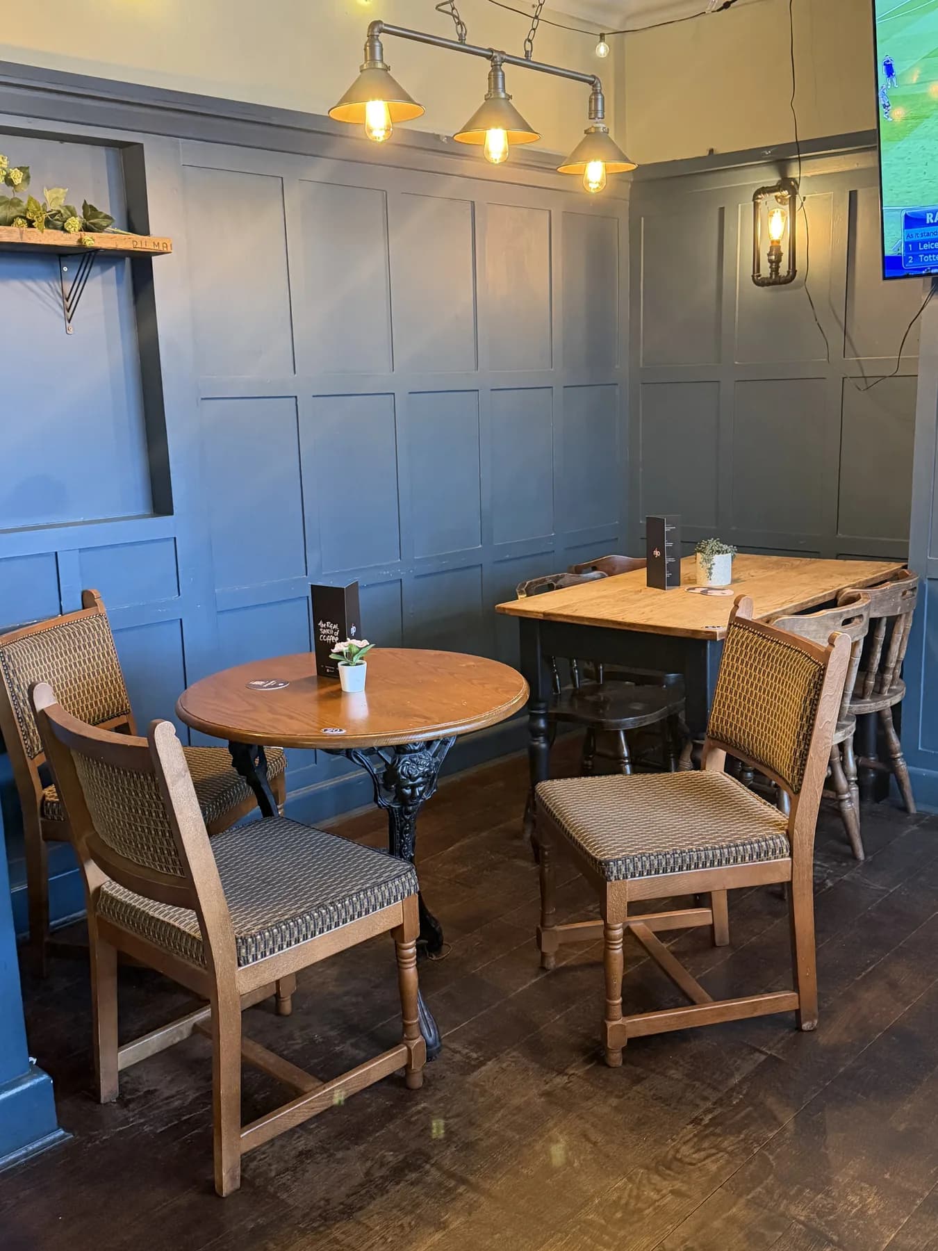 Cosy bar nook with fireplace and seating.
