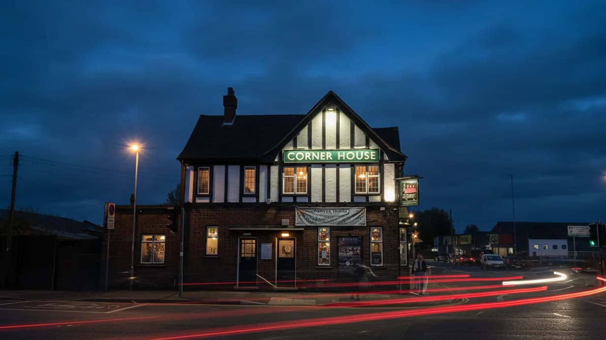 Corner House exterior at dusk with art-deco facade and signage.
