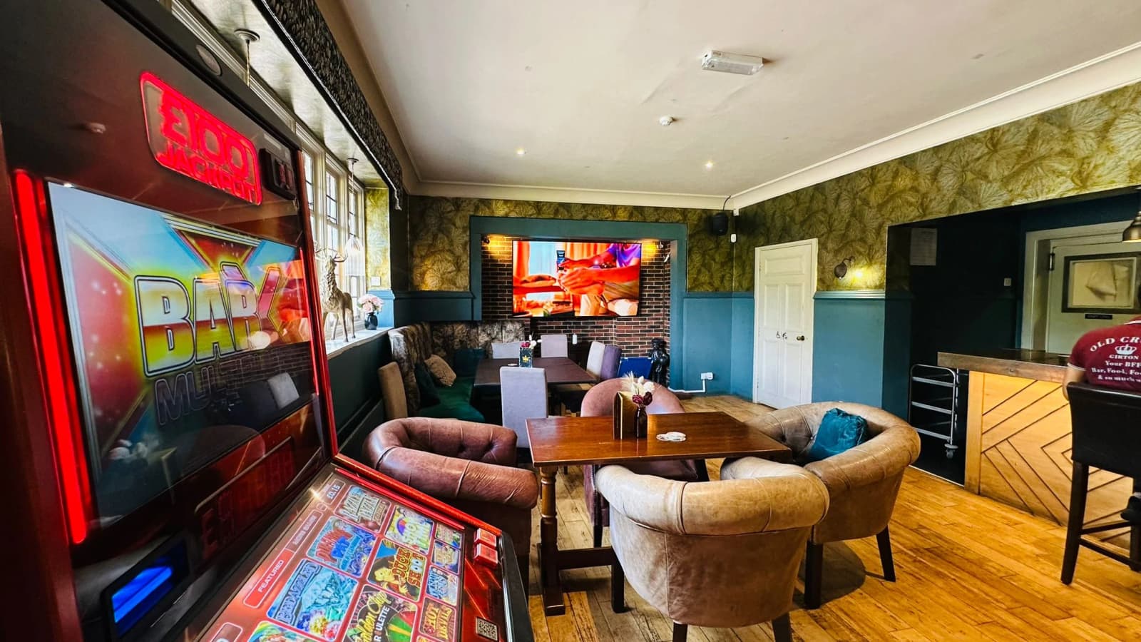 Copper-topped bar and lounge seating inside England's largest thatched pub.