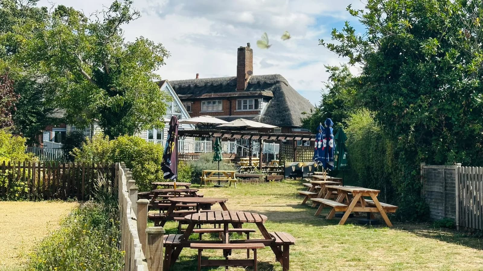 Families gathered on the lawn and picnic benches in The Old Crown's garden.
