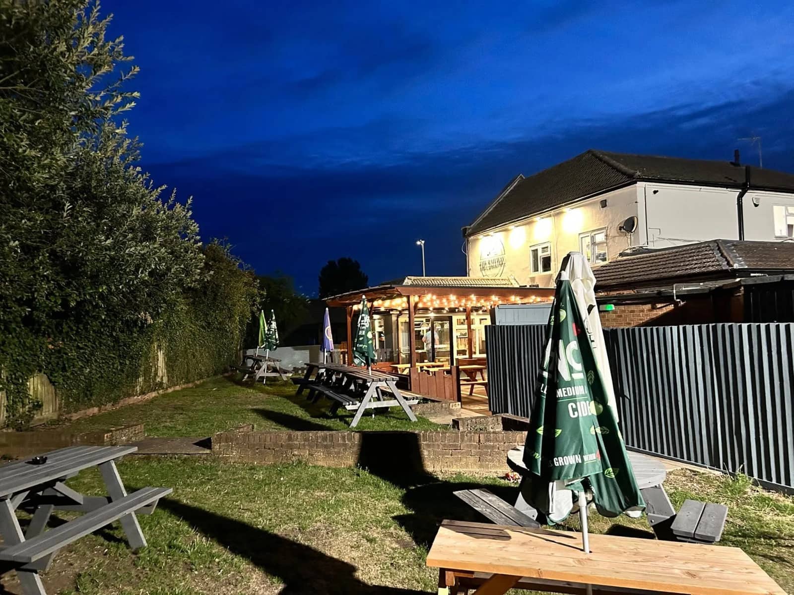 Gas-lit beer garden at night.