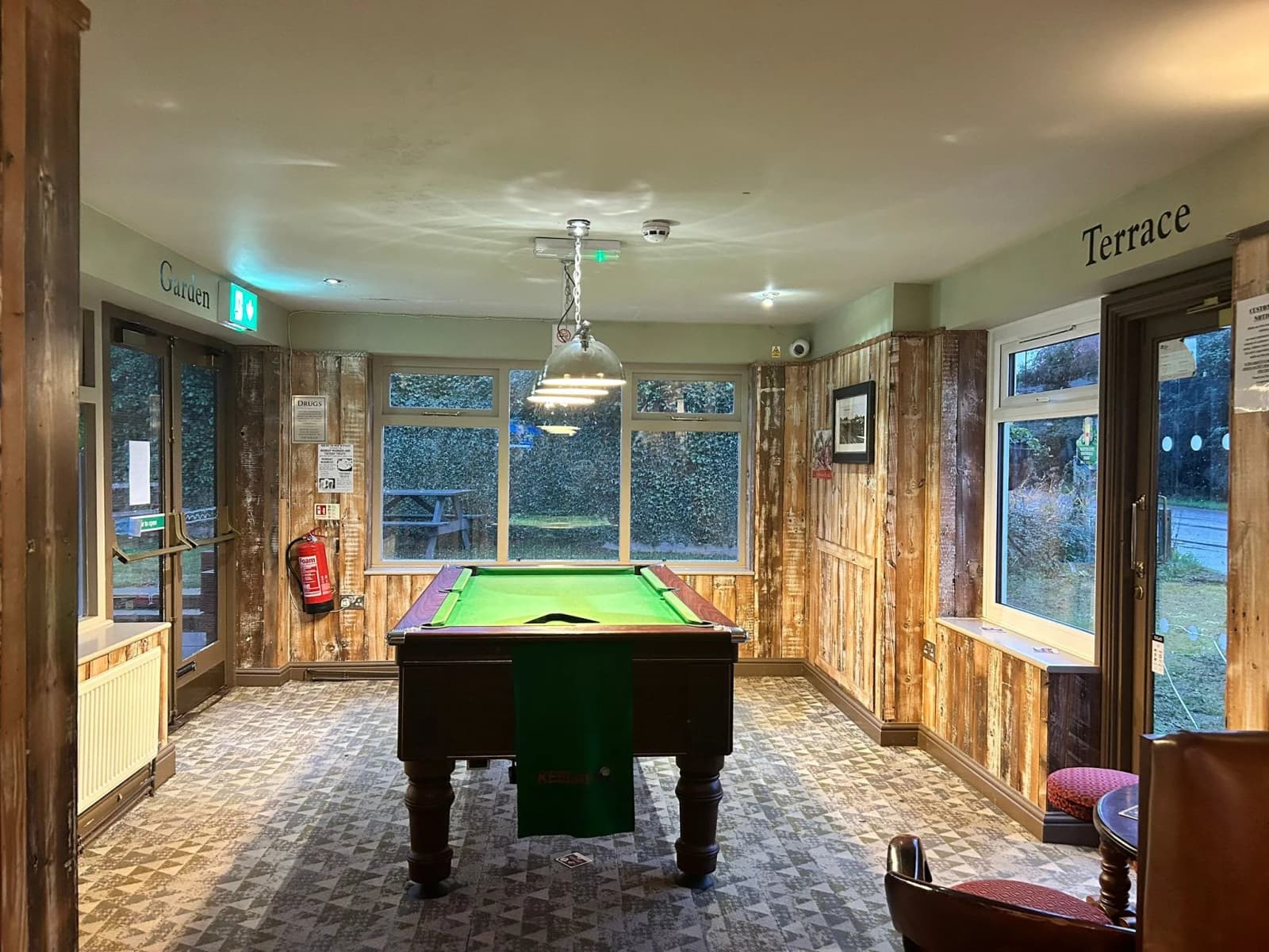 Games room with pool table.