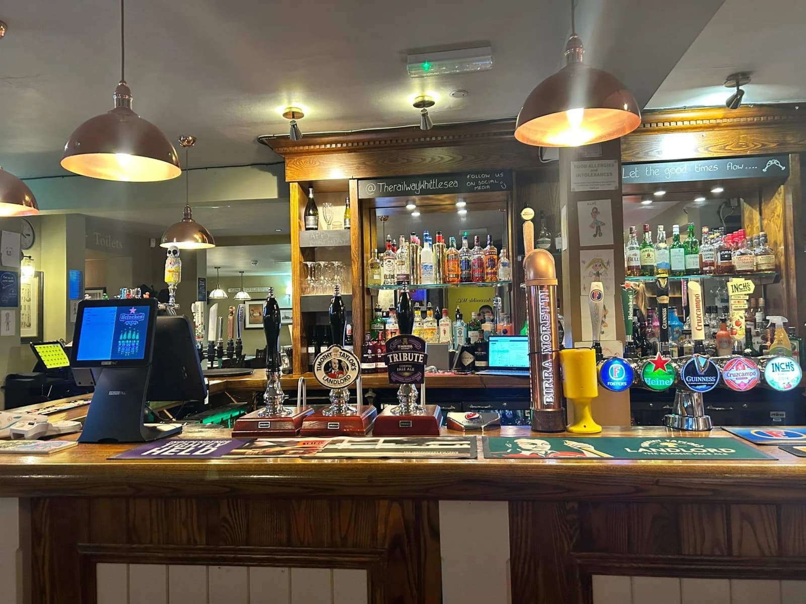 Main bar area with taps and till.